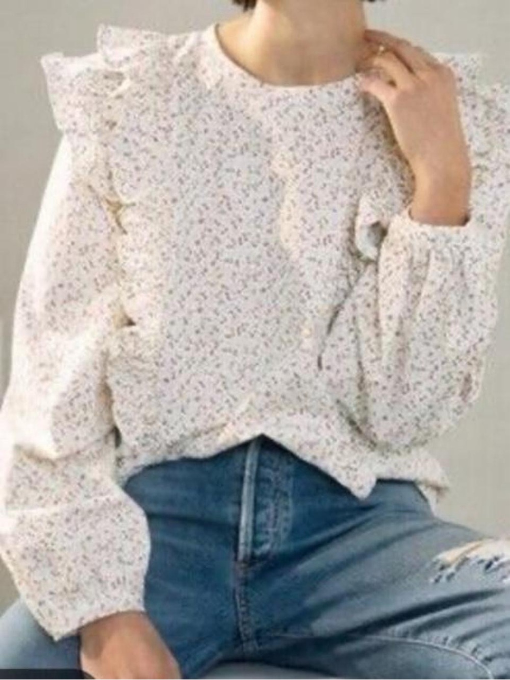 Anthropologie white cotton blouse with small pink ditzy floral print and ruffles